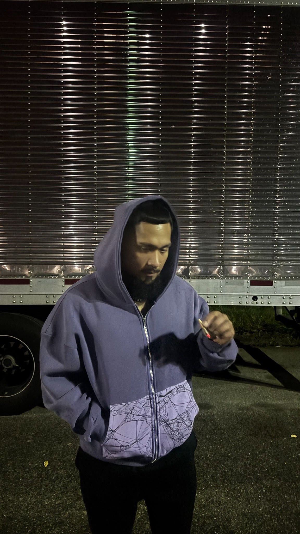 Mamba purple zip-up hoodie with spiderweb pocket panels, styled on a model