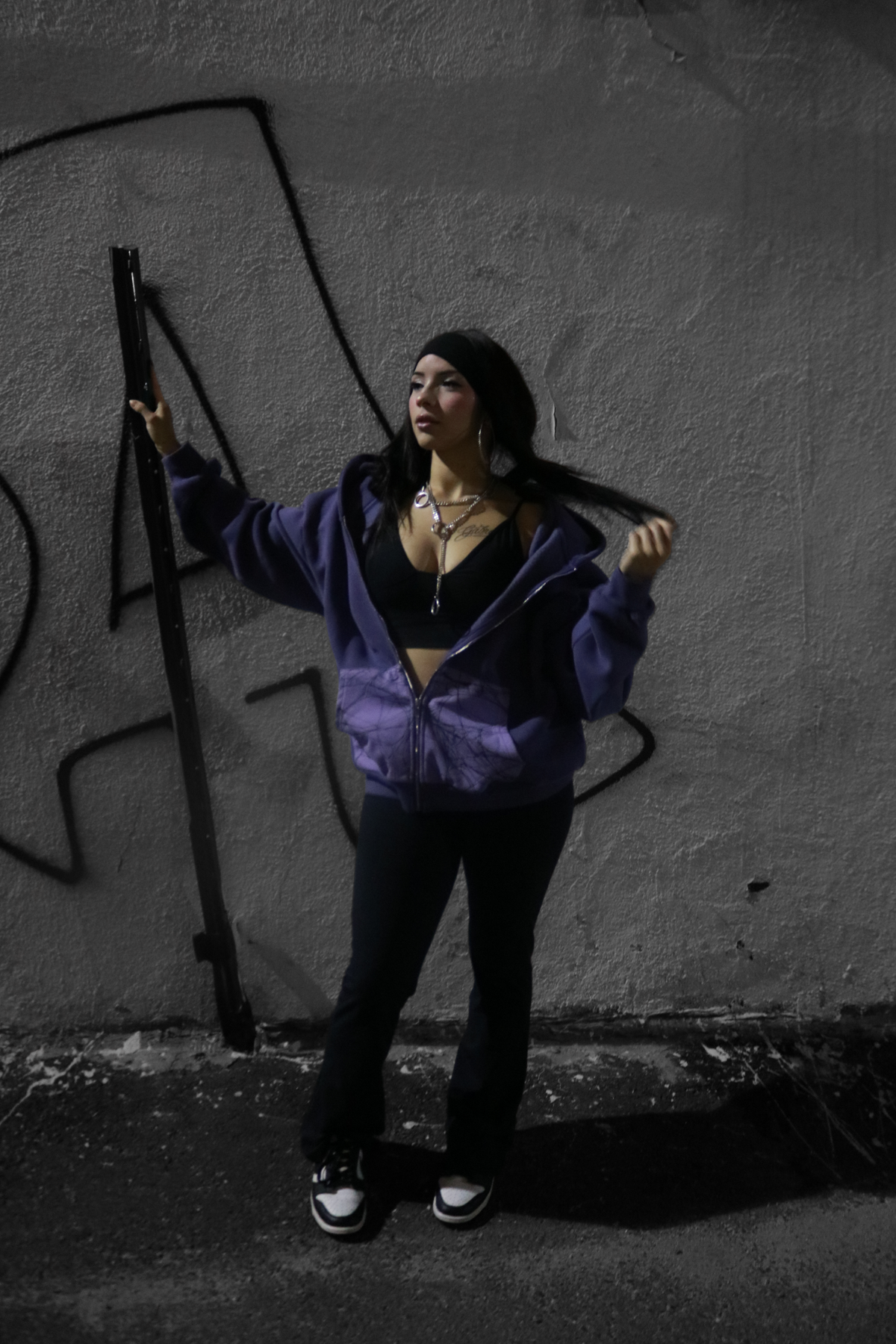 Mamba purple zip-up hoodie with spiderweb pocket panels, styled on a model