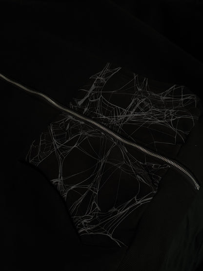 Close-up of Webster hoodie spiderweb pockets and silver-tone zipper