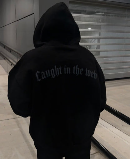 Back of the black Webster hoodie with Caught in the Web lettering